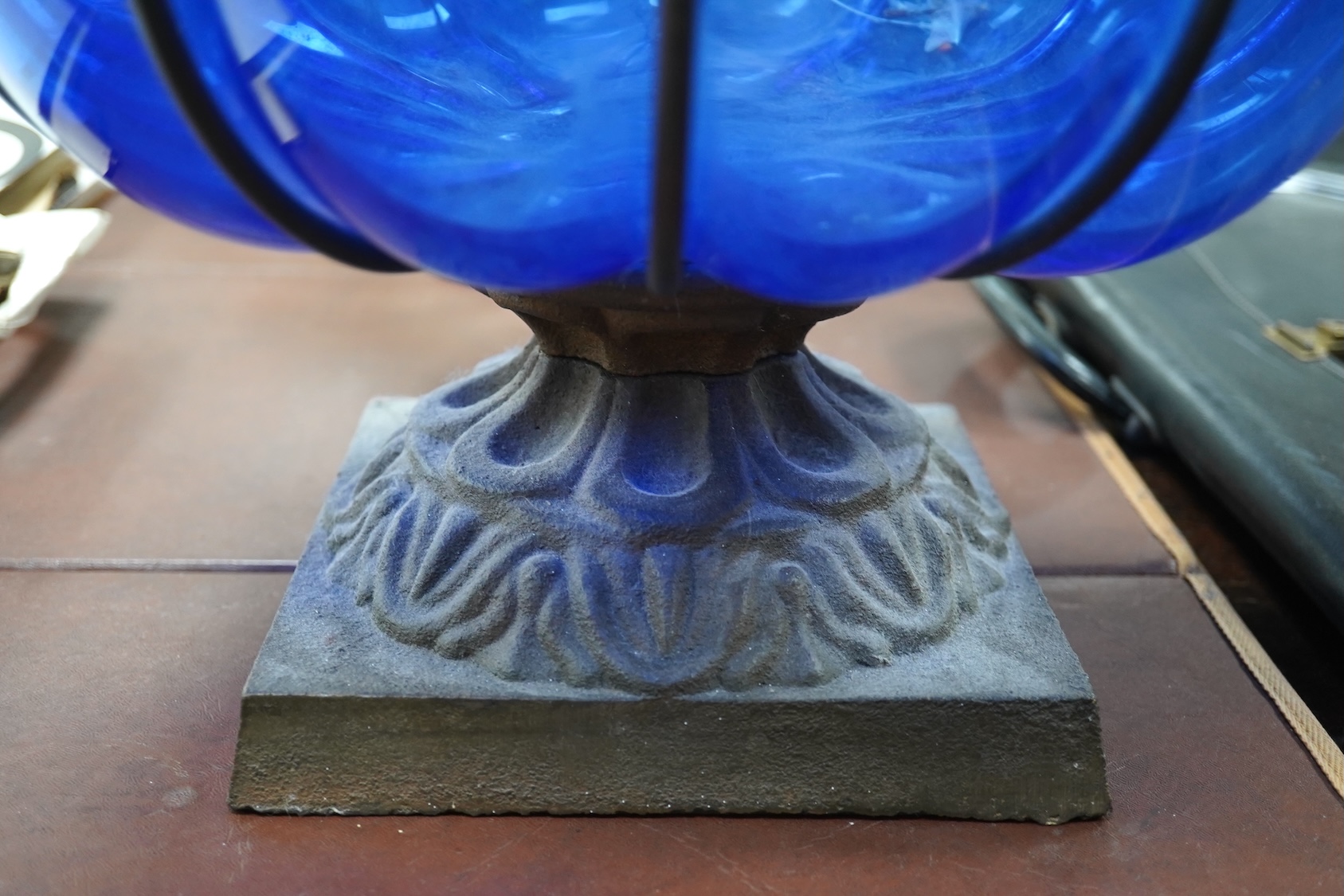 A wrought and cast iron mounted large blue glass vase, 49cm. Condition - would benefit from a clean, otherwise good